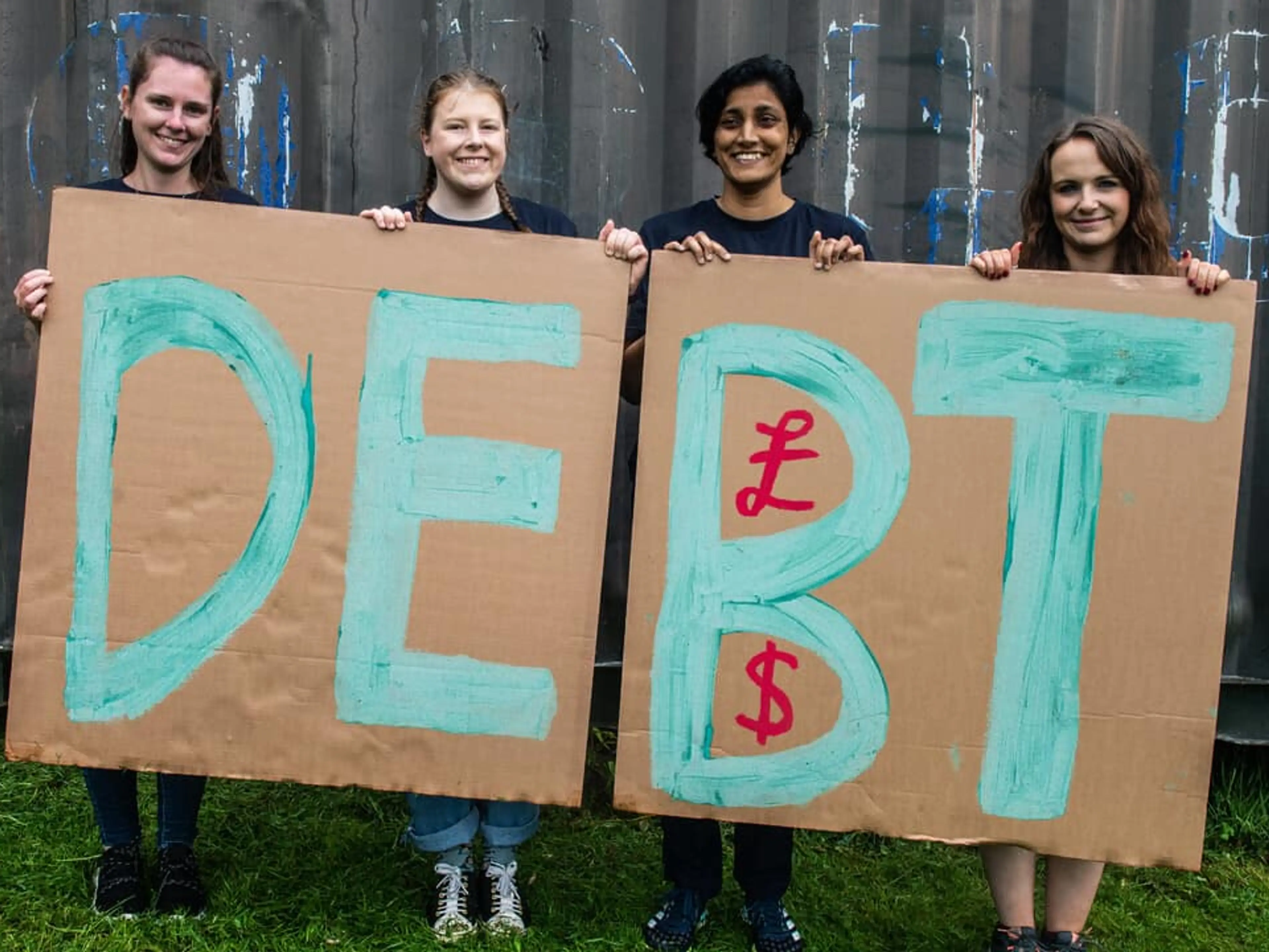UK - Plymouth - CAFOD supporters holding Debt sign at G7 2021