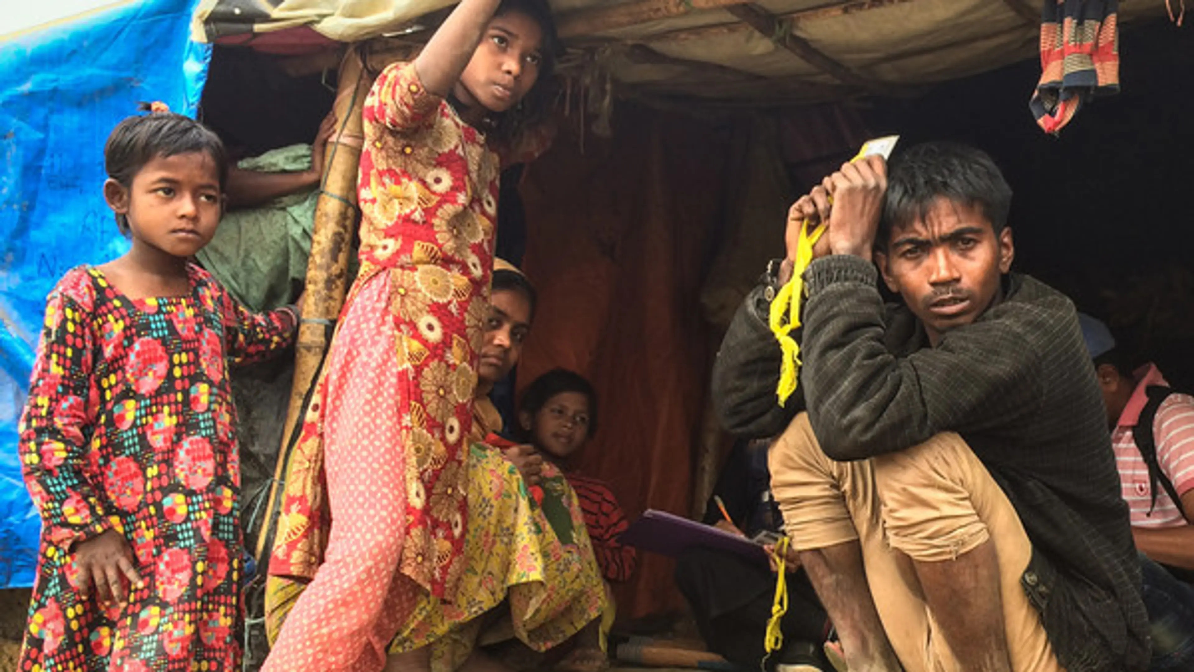 Asia - Bangladesh - Rohingya camp - man and children in poor housing