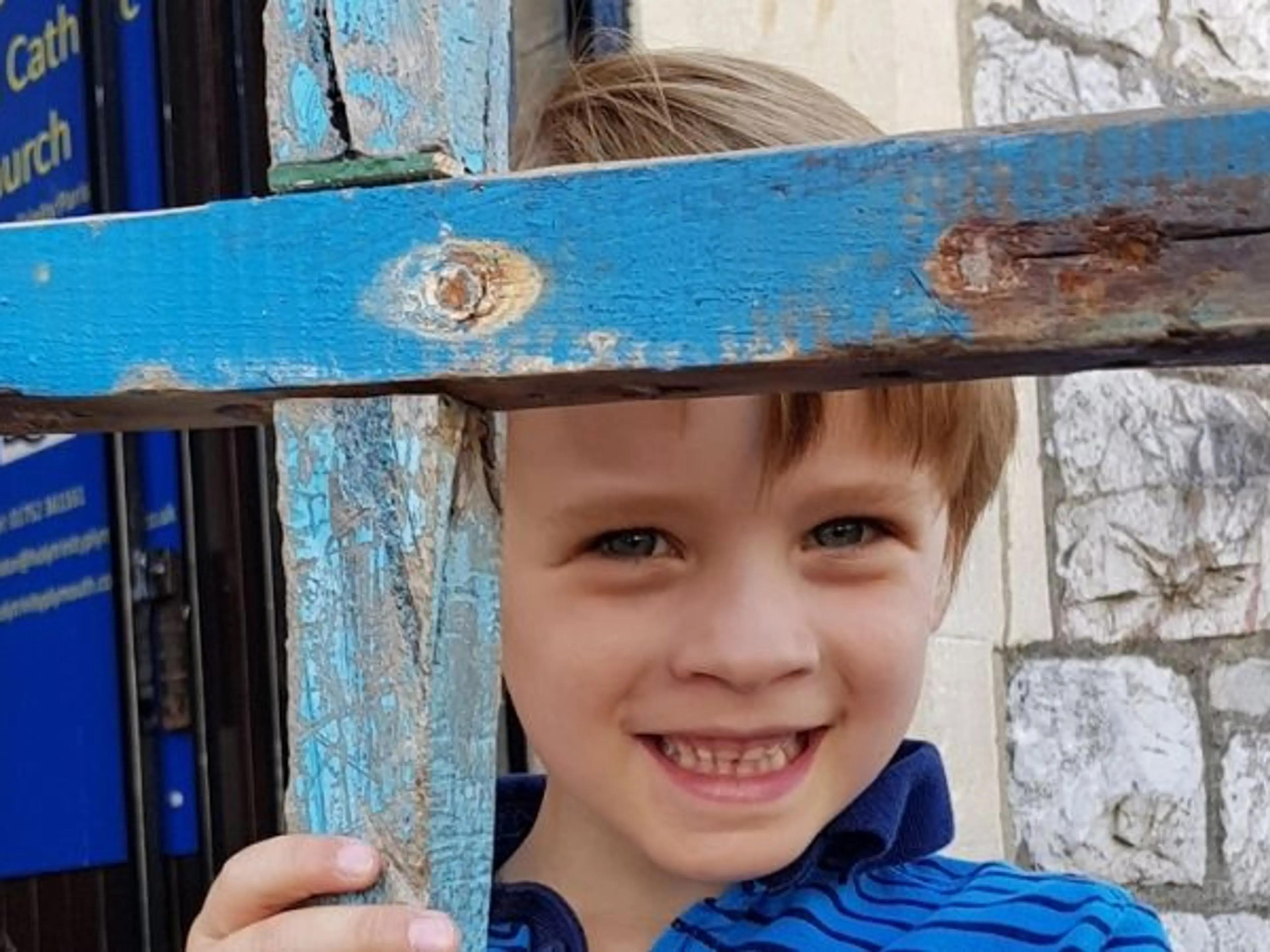 Boy with the Lampedusa cross